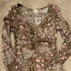 BKE from the Buckle snake print button accent top.